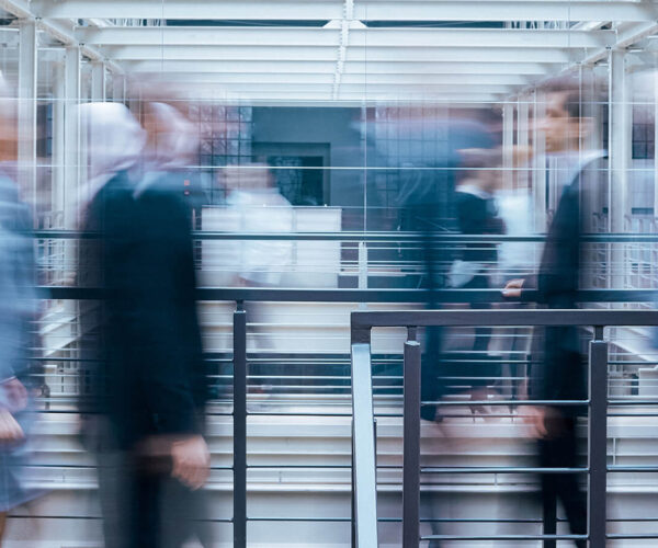 business-people-talking-in-corridor-PSVCLEM(1)